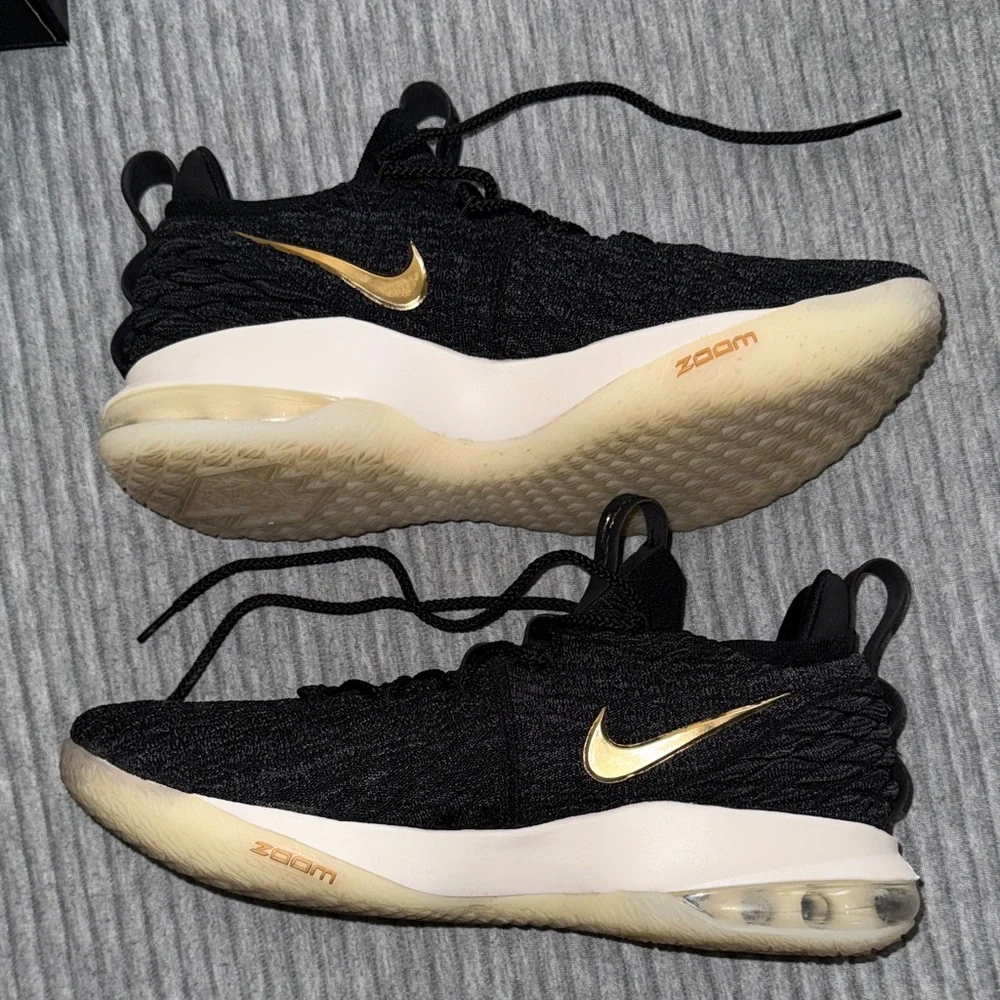 Nike LeBron 15 Low in the Black/Metallic Gold/Phantom colorway. - Picture 4 of 5
